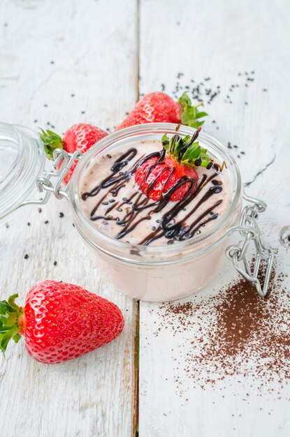 Homemade yogurt in a jar with strawberry