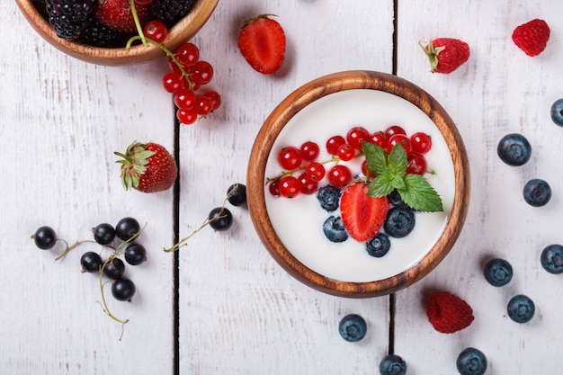 Homemade Yogurt, sour cream i with different berries