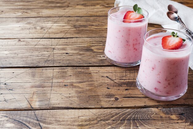 Homemade yogurt with fresh strawberries in glasses 