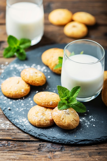 Homemeade cookies with milk on the wooden table
