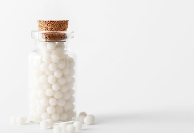 Homeopathic pills shot against a white background alternative medicine