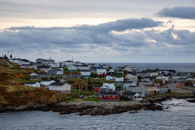 Homes in a little town on the rocky Atlantic Ocean Coast during a cloudy sunset