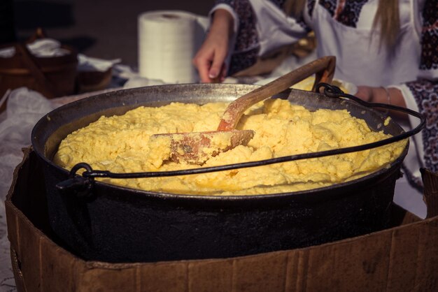 Hominy prepared in a caldron on fire