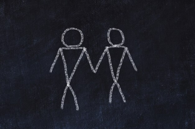 homosexual couple concept. chalk sketch on black board.