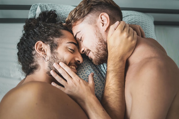 Photo homosexual male couple caressing shirtless in the bed lgbt gay lifestyle concept