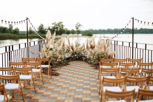 Hona wedding ceremony on the pier near the water