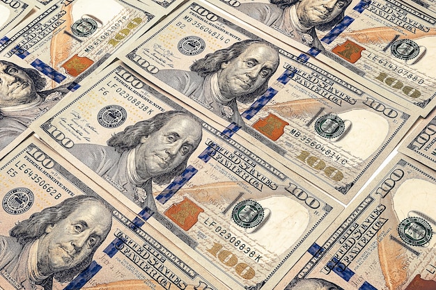 Honderd Amerikaanse dollars achtergrond Veel biljetten Amerikaanse dollars bankbiljetten Geldtextuur