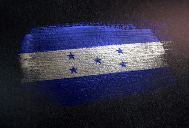 Honduras flag made of metallic brush paint on grunge dark wall