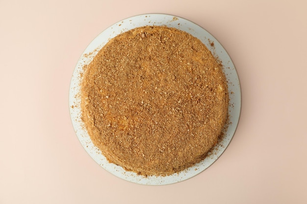 Honey cake on beige background, top view