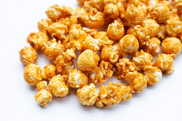 Honey caramel popcorn on white background