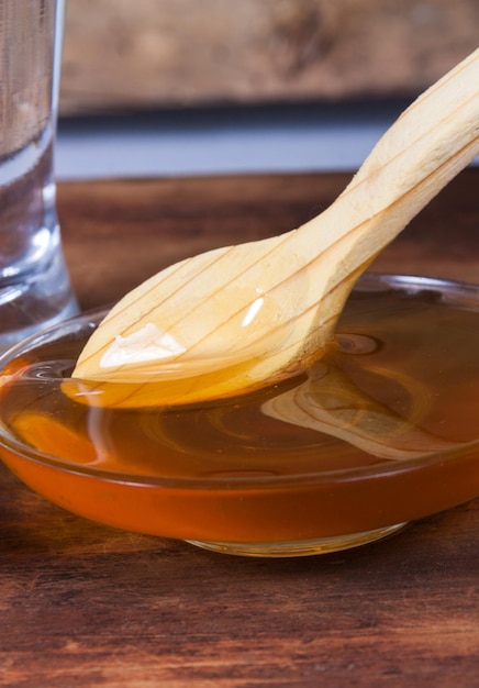 Photo honey closeup with wooden spoon