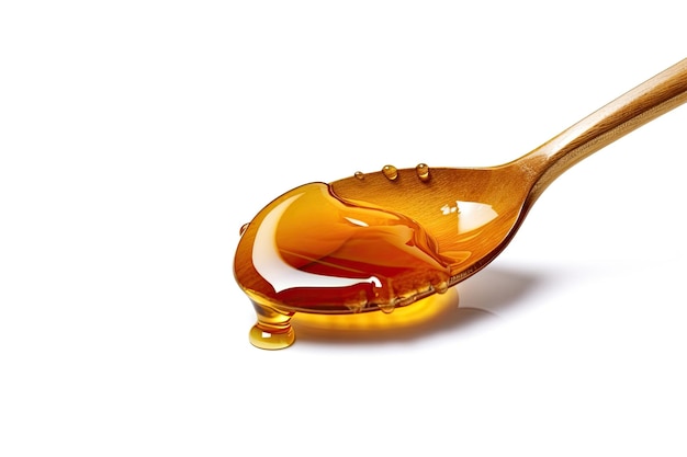 Honey Dripping From A Spoon On White Background