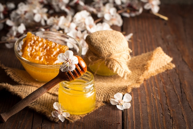 Honey dripping from a wooden honey dipper