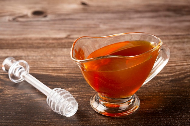 Honey in glass bowl on the table