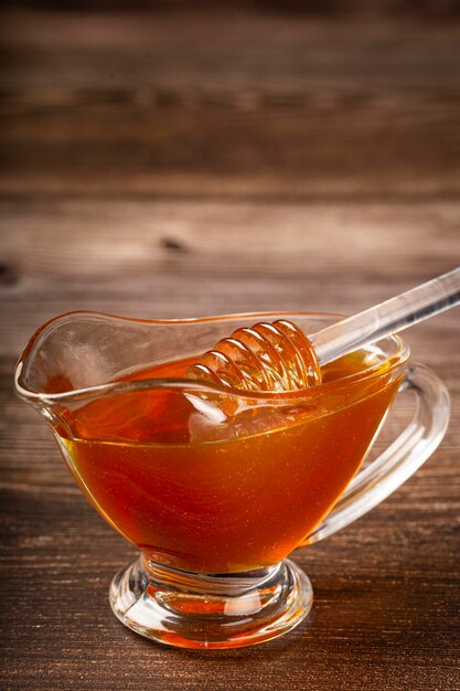 Honey in glass bowl on the table