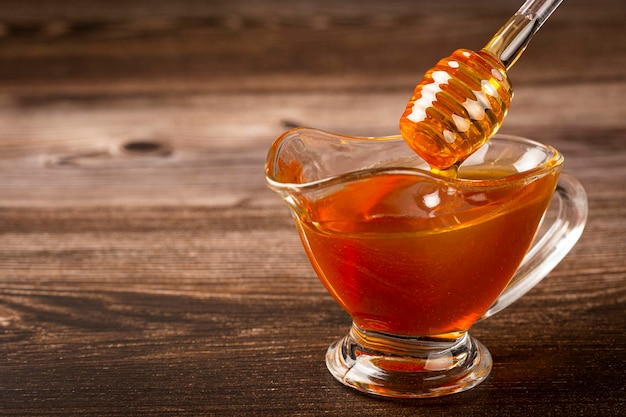 Honey in glass bowl on the table