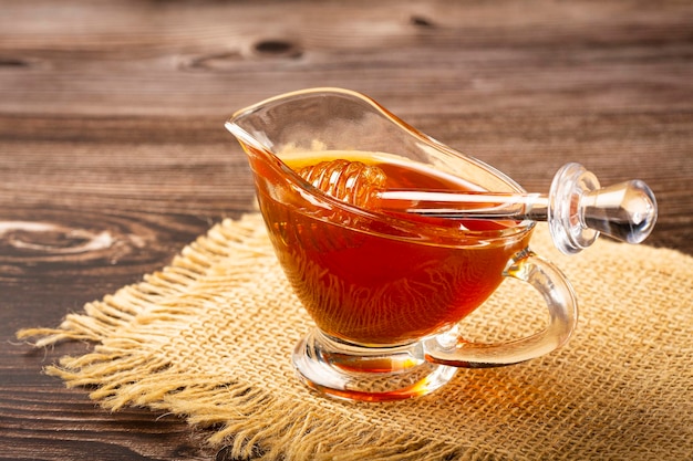 Honey in glass bowl on the table