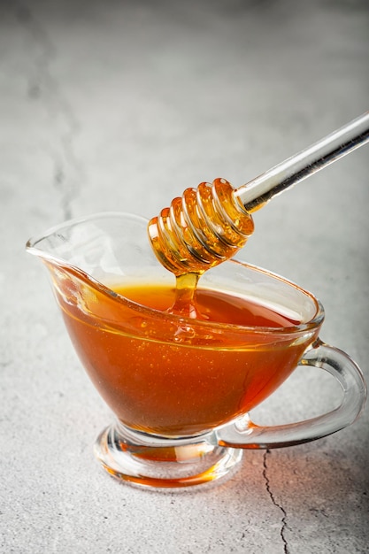 Honey in glass bowl on the table