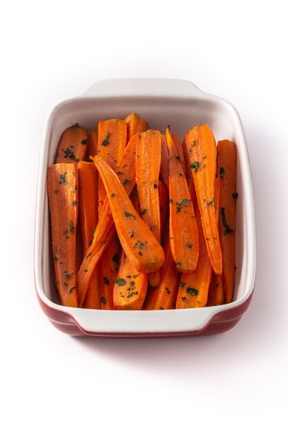 Honey glazed carrots isolated on white