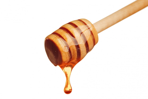 honey and honey comb with wooden stick