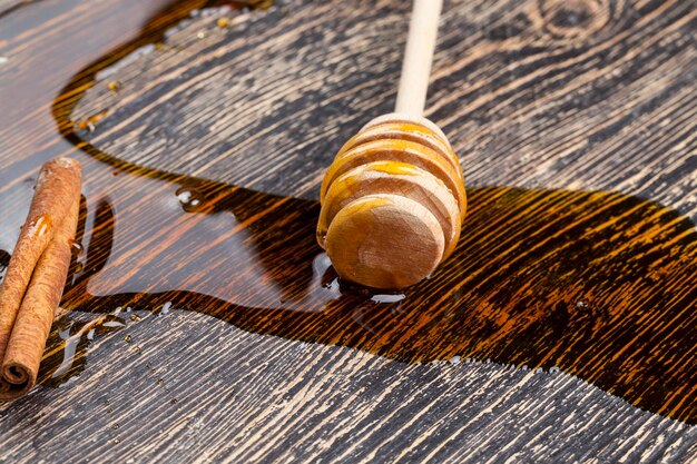 Honey and honey spoons on a wooden table