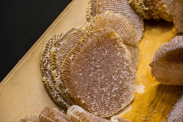 Honey in honeycomb from round beehive with honey