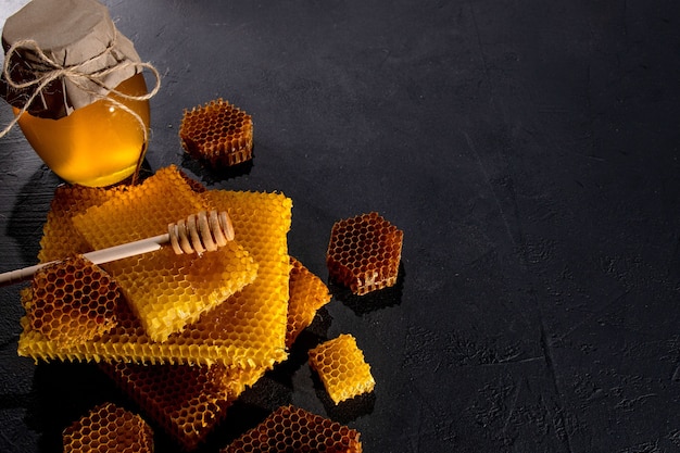 Honey in a jar and a honeycomb