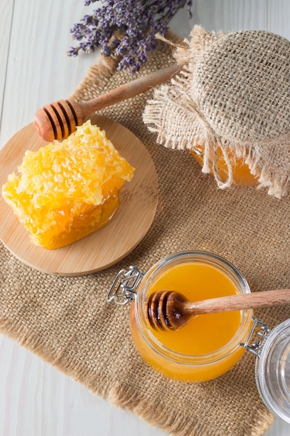 Honey in a jar on wooden rustic background