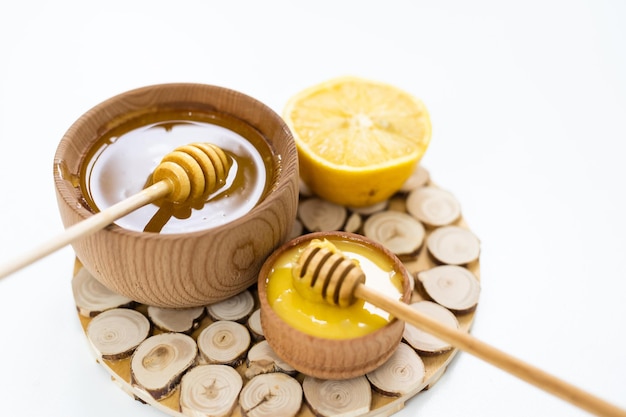 honey and lemon on white - alternative medicine.