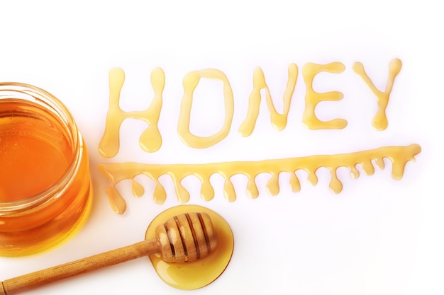 Honey letter drips isolated on a white background