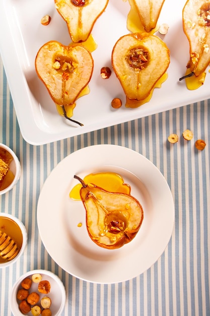 Honey or marple syrup roast pears with walnuts Vegetarian diet health delicious dessert