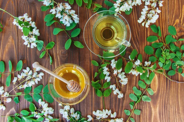 Honey with acacia and tea. Selective focus.