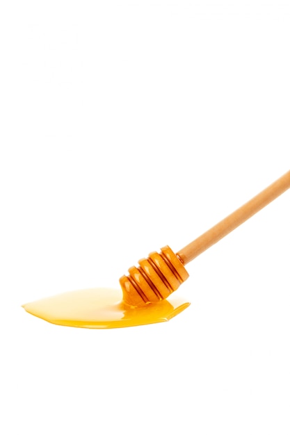 Honey with wooden drizzler isolated 