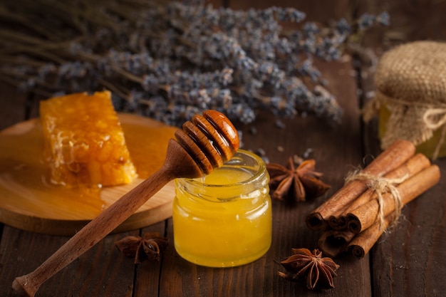 Honey on wooden background.