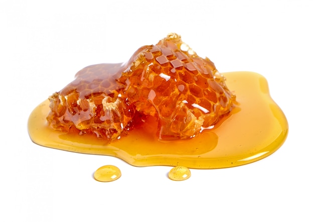 Photo honeycomb and honey isolated on white