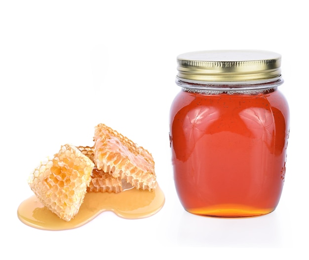 Honeycomb honey jar on whith background
