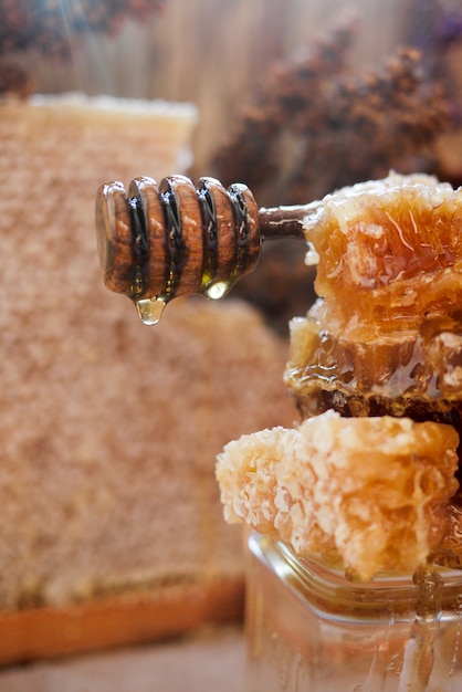 honeycomb with honey spoon