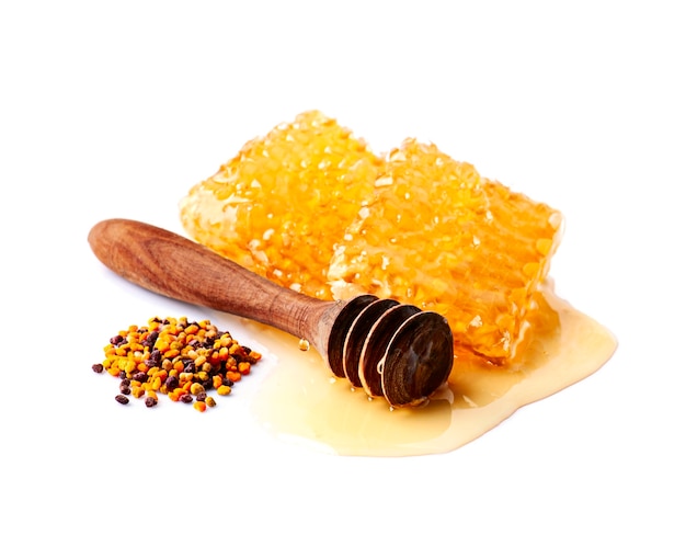 Honeycomb with pollen on white backgrounds.Healthy food ingredient.
