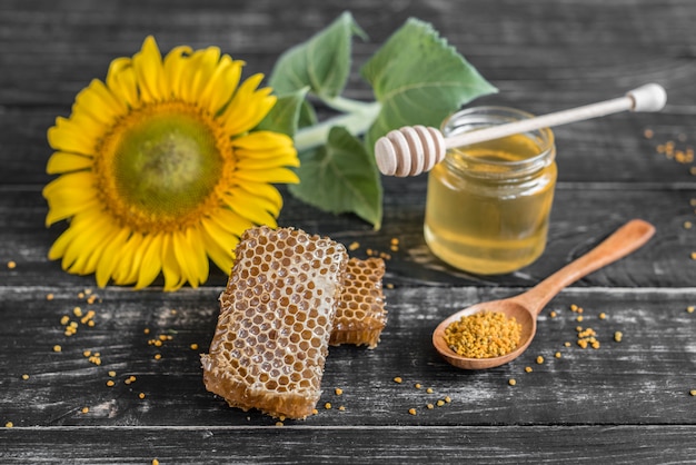 Honeycombs and pollen on a wooden table