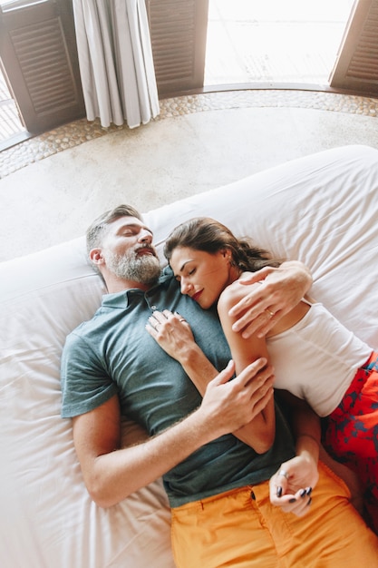 Honeymoon couple relaxing in a hotel room