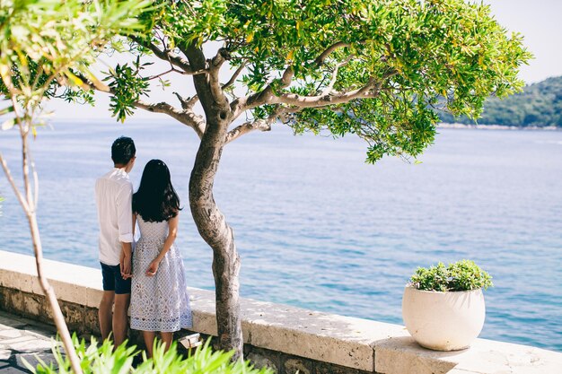 Honeymoon couple  on vacation in Europe with sea view Hands together back view Dubrovnik