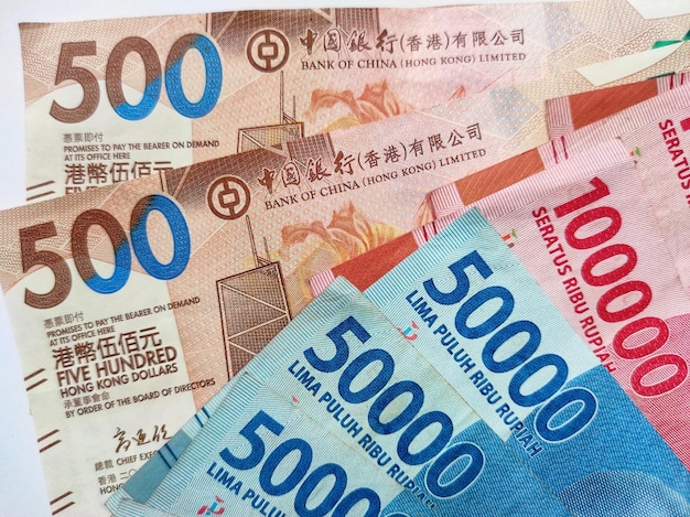 Hong Kong 500 dollar banknotes 50000 and 100000 Indonesian rupiah banknotes on white background