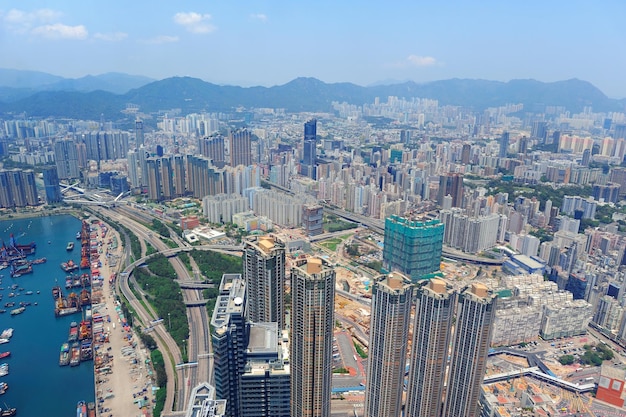 Hong Kong aerial view panorama with urban skyscrapers and sea.