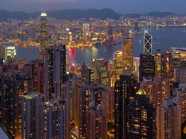 Hong Kong city night view with twilight and Victoria harbor from the peak observation deck