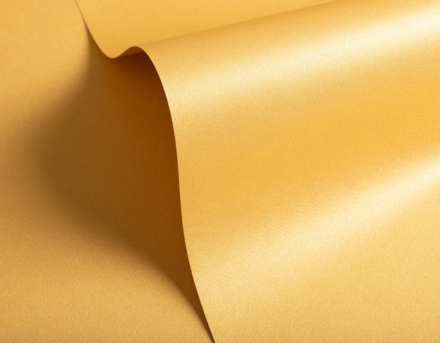 Honinggoud papier achtergrond met een gladde parelschijnende textuur en een glinsterende glanzende afwerking Warm