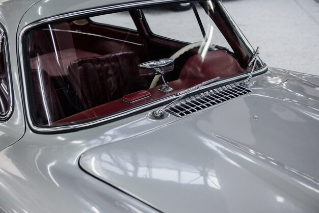 Hood and glass of the beautiful white vintage car