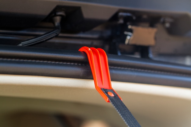 The hook for helping driver inside car trunk.