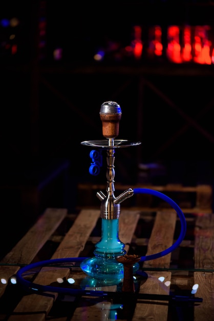hookah on the background of a bar, light, smoke, smog