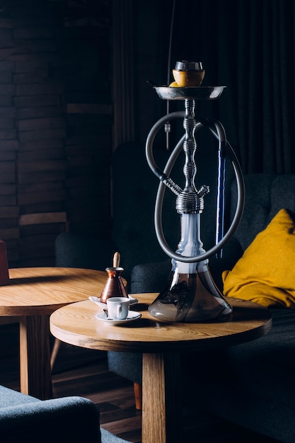 Photo hookah on shisha bowl with dark background