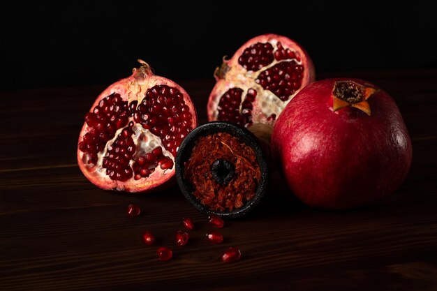 A hookah smoking bowl filled with red pomegranate flavor tobacco